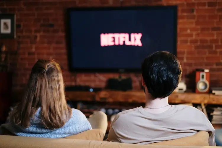 Two people watching Netflix