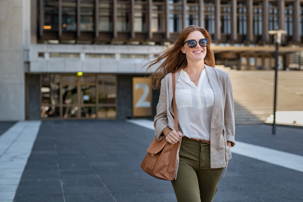 woman walking outdoor feeling confident