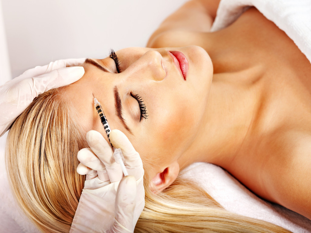 a woman getting a facial prodecure